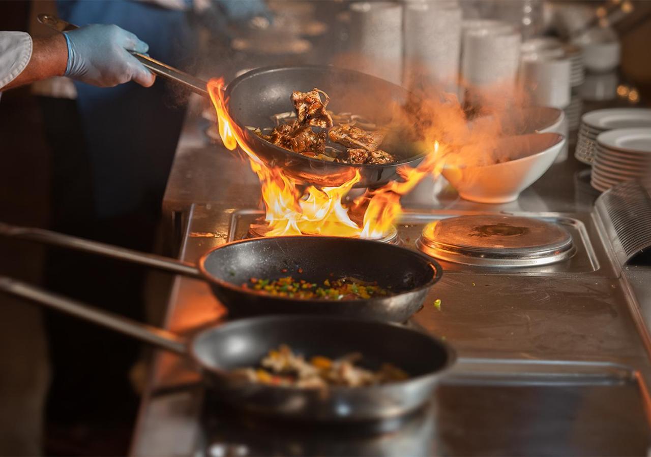 Crystal Inn Hotel - Alamein (Adults Only) El Alamein Exteriör bild A chef cooking with a wok