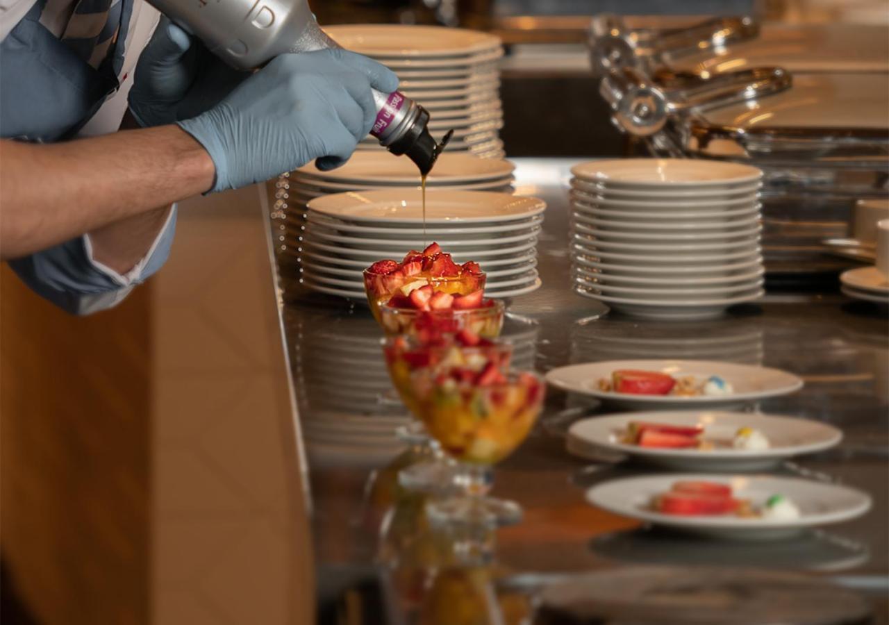 Crystal Inn Hotel - Alamein (Adults Only) El Alamein Exteriör bild A pastry chef finishing a dessert